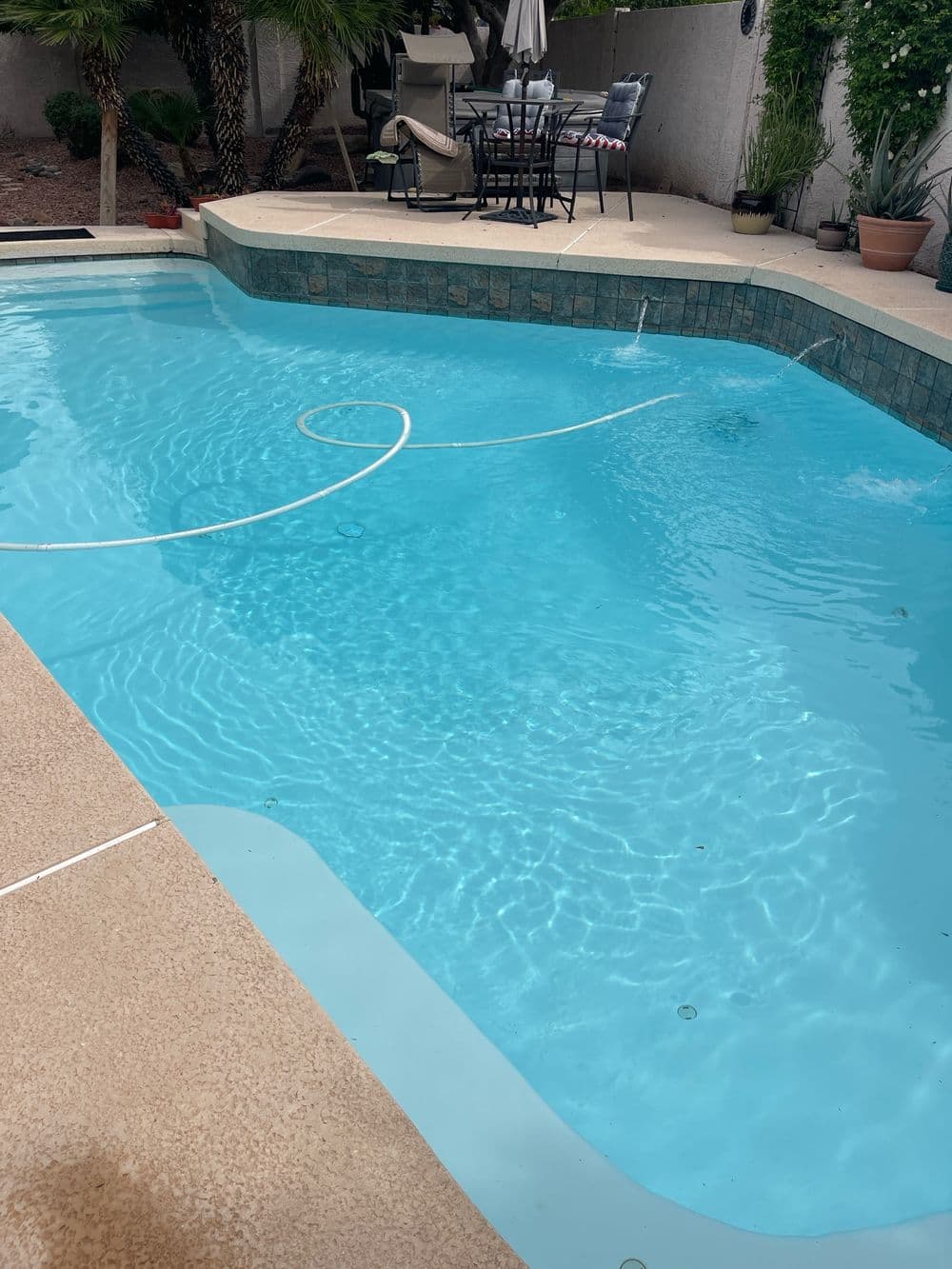 A sparkling clean residential pool perfect for relaxation.
